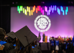 View from behind of students assembled at a RISD Commencement ceremony